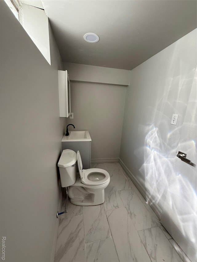 19612 Gaukler St, Saint Clair Shores, MI 48080 - bathroom with toilet and marble look tile flooring