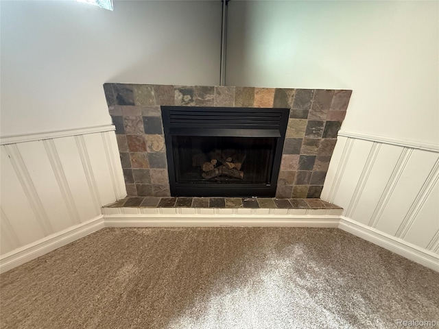 19612 Gaukler St, Saint Clair Shores, MI 48080 - detailed view of a decorative wall, carpet flooring, a fireplace with raised hearth, and wainscoting