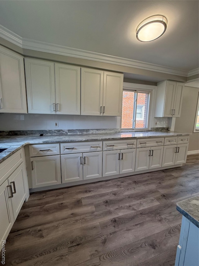 19612 Gaukler St, Saint Clair Shores, MI 48080 - kitchen with crown molding, dark wood-style flooring, white cabinetry, and light stone countertops