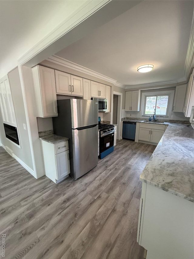 19612 Gaukler St, Saint Clair Shores, MI 48080 - kitchen with appliances with stainless steel finishes, ornamental molding, light wood-style flooring, and light stone countertops