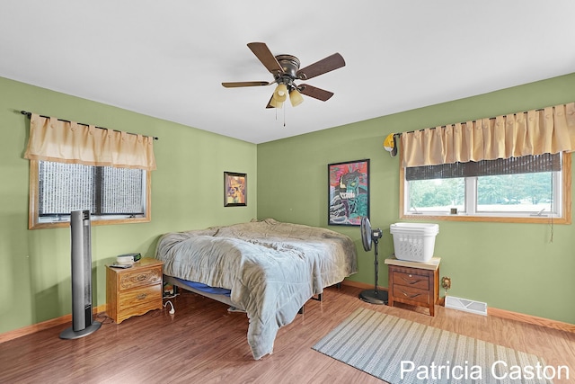 4707 Cannonsburg Rd NE, Belmont, MI 49306 - bedroom with wood finished floors and a ceiling fan