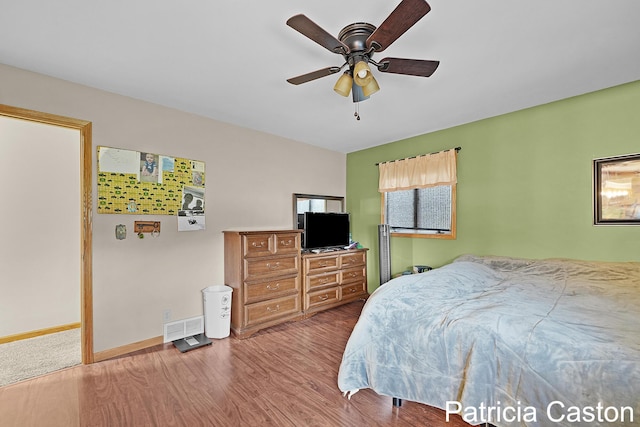 4707 Cannonsburg Rd NE, Belmont, MI 49306 - bedroom featuring wood finished floors and ceiling fan