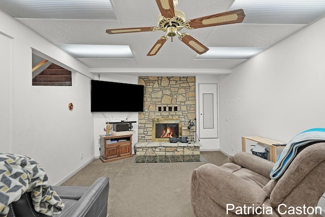 4707 Cannonsburg Rd NE, Belmont, MI 49306 - living area with carpet floors, ceiling fan, and a fireplace