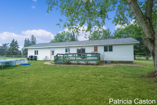 4707 Cannonsburg Rd NE, Belmont, MI 49306 - rear view of property featuring a deck, a covered pool, and roof with shingles