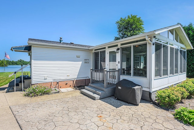 432 Spaulding Dr, Coldwater, MI 49036 - back of property featuring a sunroom and a patio