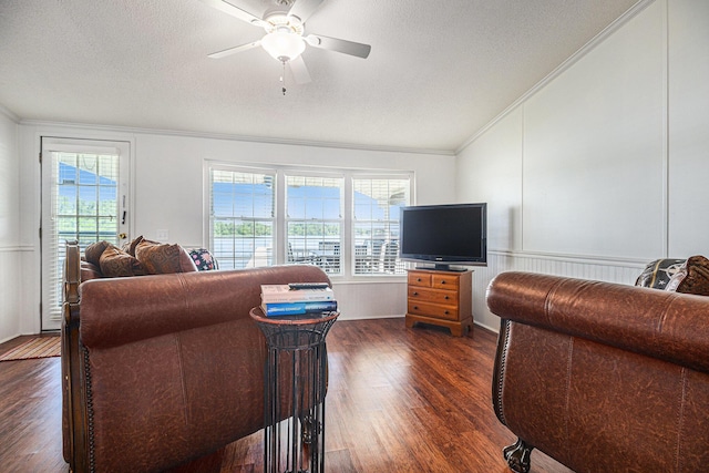 432 Spaulding Dr, Coldwater, MI 49036 - living area featuring vaulted ceiling, ornamental molding, dark wood finished floors, ceiling fan, and a textured ceiling
