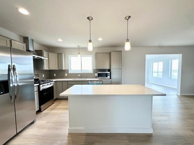 LOT100 Wren Dr SE, Caledonia, MI 49316 - kitchen with stainless steel appliances, gray cabinetry, backsplash, light wood-style flooring, and recessed lighting
