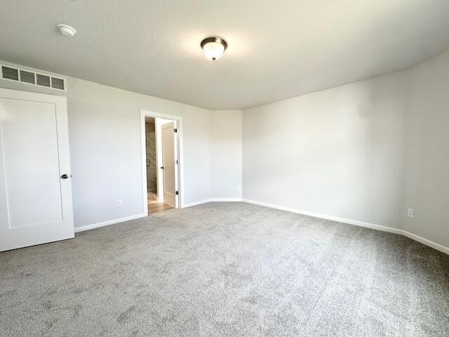 LOT100 Wren Dr SE, Caledonia, MI 49316 - empty room featuring carpet floors and a smoke detector