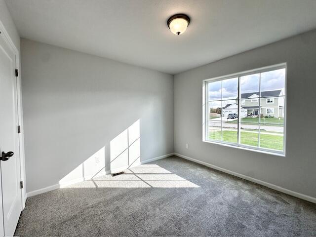 LOT100 Wren Dr SE, Caledonia, MI 49316 - carpeted spare room featuring baseboards