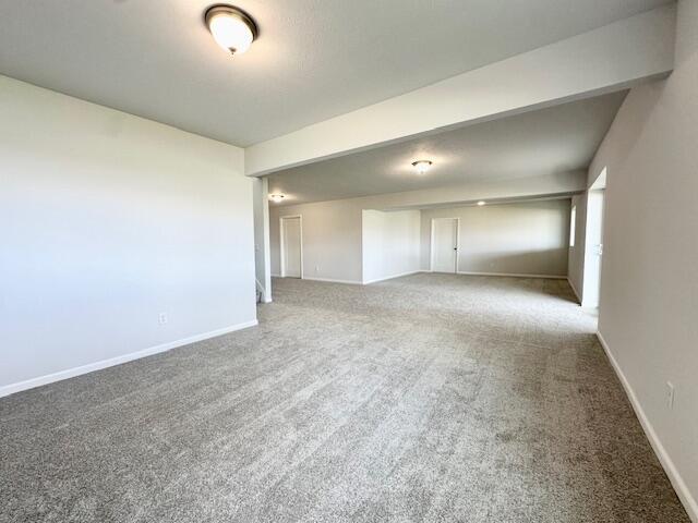 LOT100 Wren Dr SE, Caledonia, MI 49316 - empty room featuring carpet flooring and baseboards