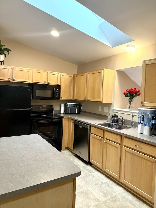7366 Maplelawn Dr, Ypsilanti, MI 48197 - kitchen with black appliances, light brown cabinetry, lofted ceiling, a skylight, and light countertops