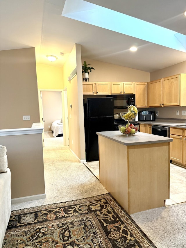 7366 Maplelawn Dr, Ypsilanti, MI 48197 - kitchen with light brown cabinets, lofted ceiling, black appliances, light colored carpet, and a kitchen island