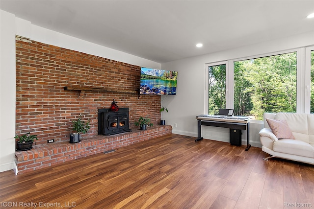 6727 Napier Rd, Plymouth, MI 48170 - living area with wood finished floors, a wood stove, and recessed lighting