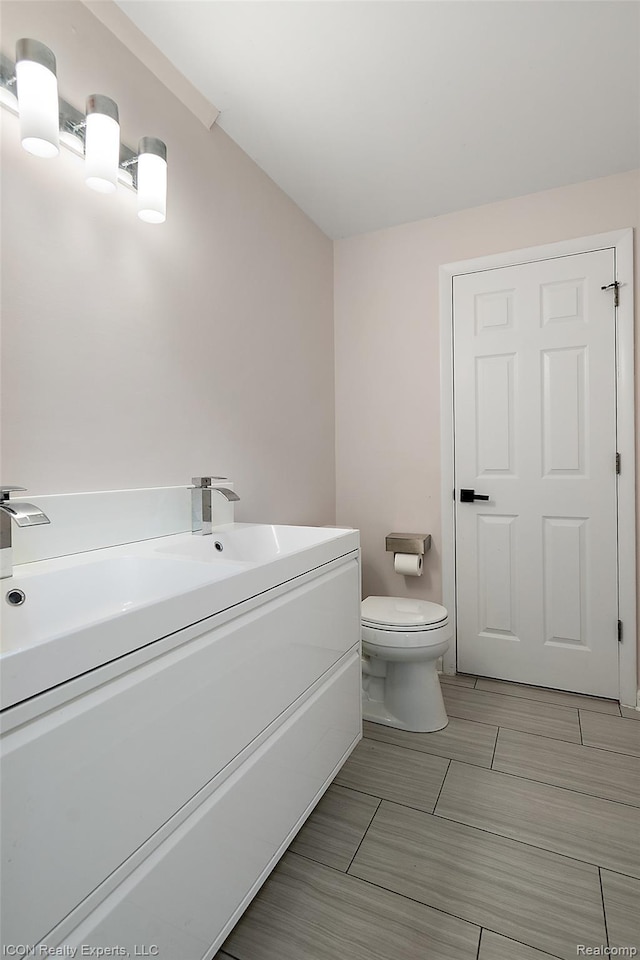 6727 Napier Rd, Plymouth, MI 48170 - bathroom featuring toilet and vanity