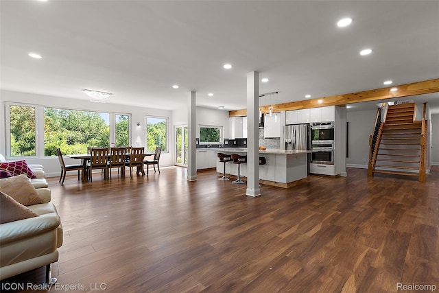 6727 Napier Rd, Plymouth, MI 48170 - living room with recessed lighting, dark wood-style floors, and stairs