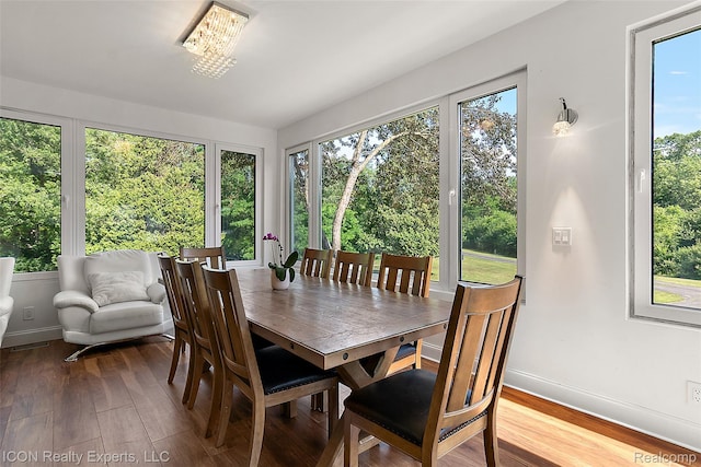 6727 Napier Rd, Plymouth, MI 48170 - dining space with healthy amount of natural light, wood finished floors, and a chandelier