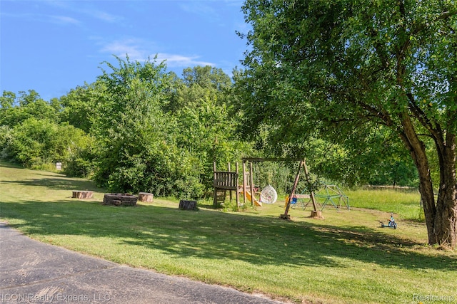 6727 Napier Rd, Plymouth, MI 48170 - view of green lawn featuring a playground