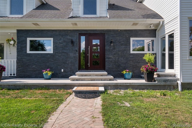 6727 Napier Rd, Plymouth, MI 48170 - entrance to property with a shingled roof, a lawn, and a porch