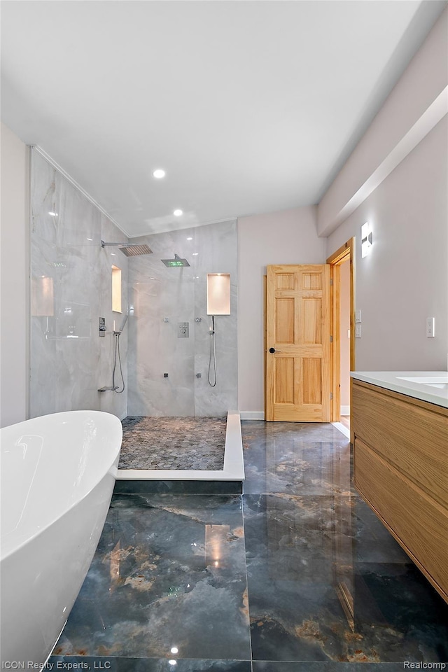 6727 Napier Rd, Plymouth, MI 48170 - bathroom with marble tiled floors, a walk in shower, a freestanding bath, vanity, and recessed lighting