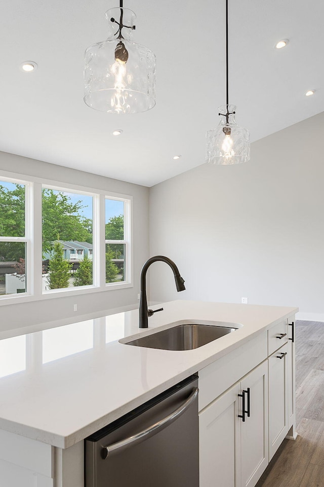 6153 Lake Wind Ave, Holland, MI 49423 - kitchen with dishwasher, light countertops, decorative light fixtures, recessed lighting, and white cabinetry