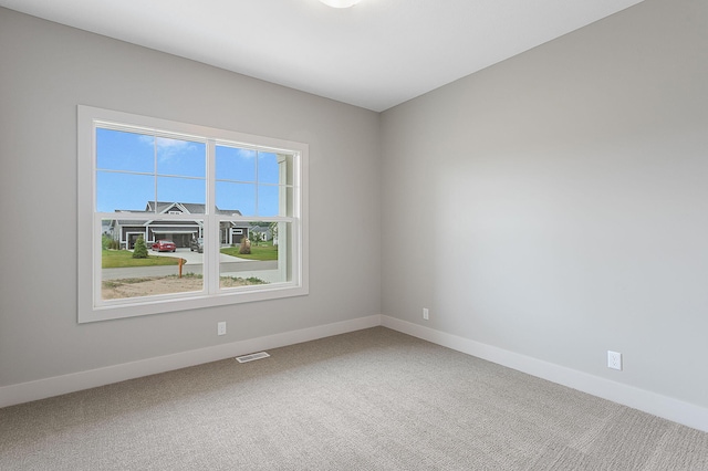 6153 Lake Wind Ave, Holland, MI 49423 - carpeted empty room with baseboards