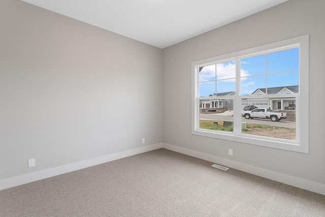 6153 Lake Wind Ave, Holland, MI 49423 - carpeted empty room featuring baseboards