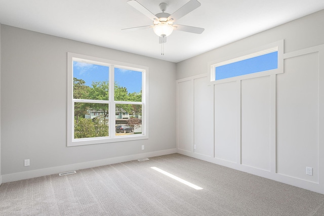 6153 Lake Wind Ave, Holland, MI 49423 - carpeted spare room featuring baseboards and a ceiling fan