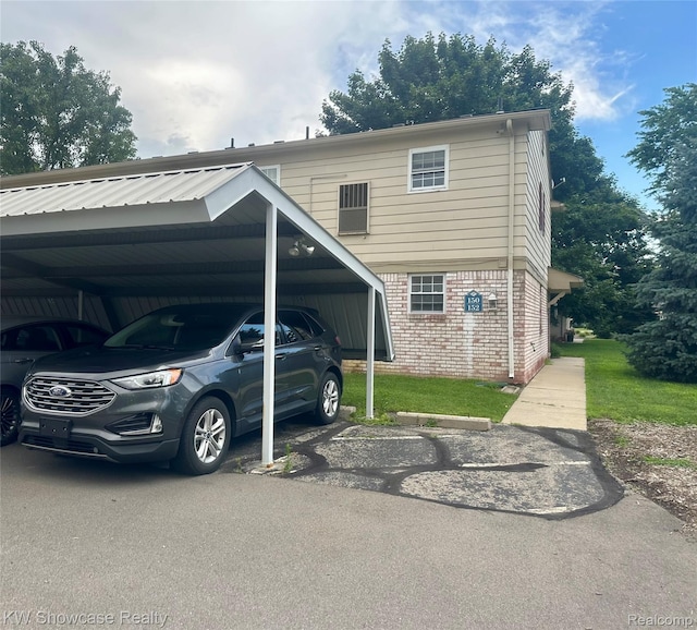 150 Princeton Dr Unit 22, South Lyon, MI 48178 - view of front of house featuring brick siding and covered parking