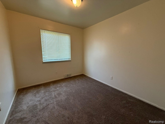 13420 Couwlier Ave, Warren, MI 48089 - unfurnished room with dark carpet and baseboards