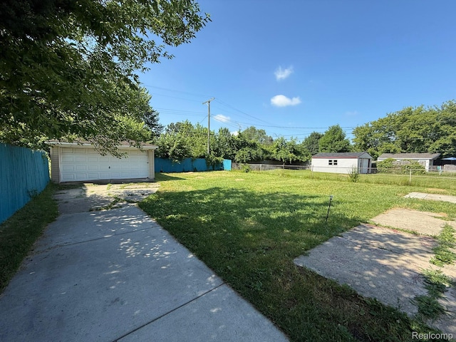 13420 Couwlier Ave, Warren, MI 48089 - view of yard featuring an outdoor structure and a garage