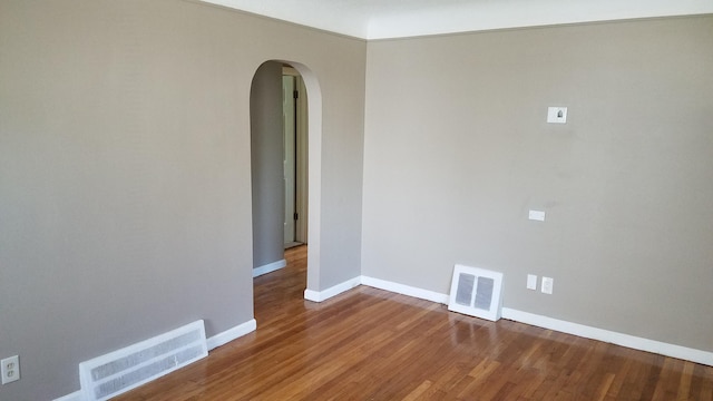 25933 Norfolk St, Inkster, MI 48141 - spare room with arched walkways and wood finished floors
