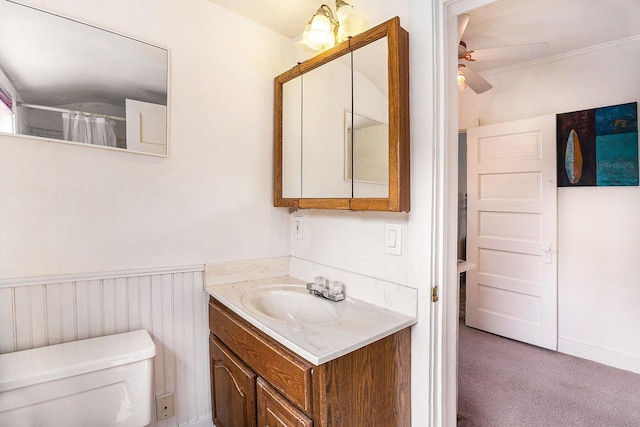 722 Conger St, South Haven, MI 49090 - full bath with vanity, a ceiling fan, and a wainscoted wall