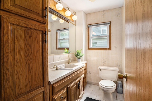 722 Conger St, South Haven, MI 49090 - half bathroom with vanity, tile patterned floors, and tile walls