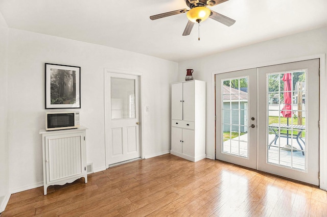722 Conger St, South Haven, MI 49090 - doorway to outside with french doors, light wood-style floors, and a ceiling fan