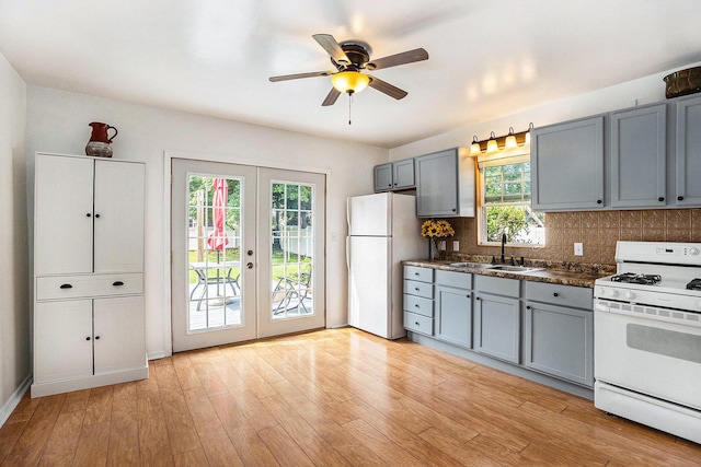 722 Conger St, South Haven, MI 49090 - kitchen with white appliances, gray cabinets, french doors, and decorative backsplash