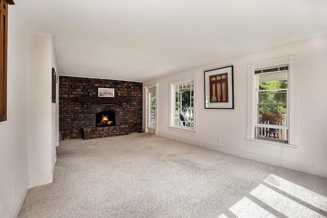 722 Conger St, South Haven, MI 49090 - unfurnished living room featuring carpet floors and a brick fireplace