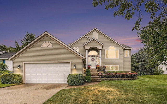 1527 Wiersma Dr, Zeeland, MI 49464 - view of front of home with concrete driveway, a lawn, and an attached garage