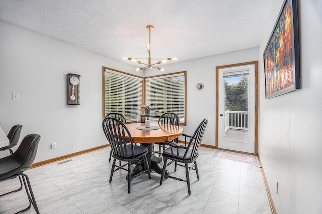 1527 Wiersma Dr, Zeeland, MI 49464 - dining room with a chandelier and light marble finish floors