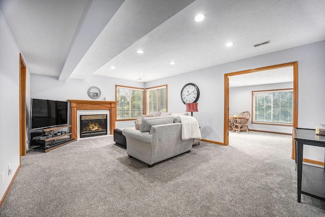 1527 Wiersma Dr, Zeeland, MI 49464 - carpeted living area with recessed lighting, plenty of natural light, and a tile fireplace