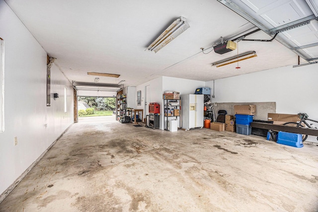 1527 Wiersma Dr, Zeeland, MI 49464 - garage featuring a garage door opener and baseboards