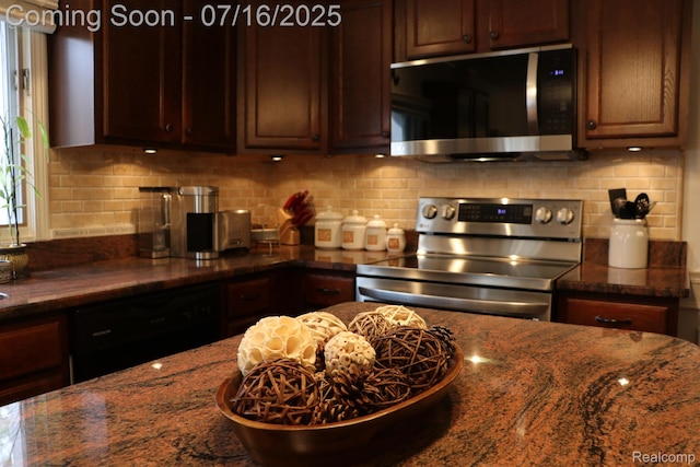 46877 W Ann Arbor Trl, Plymouth, MI 48170 - kitchen featuring stainless steel appliances, dark stone countertops, and decorative backsplash