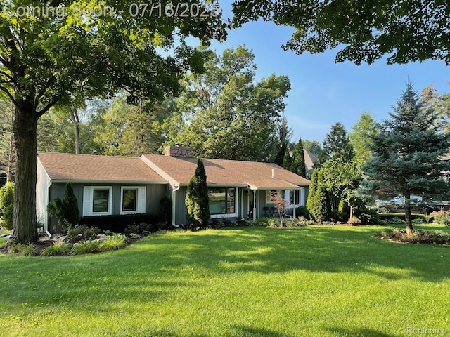 46877 W Ann Arbor Trl, Plymouth, MI 48170 - ranch-style home with a chimney and a front lawn