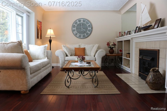 46877 W Ann Arbor Trl, Plymouth, MI 48170 - living area featuring hardwood / wood-style flooring and a tiled fireplace