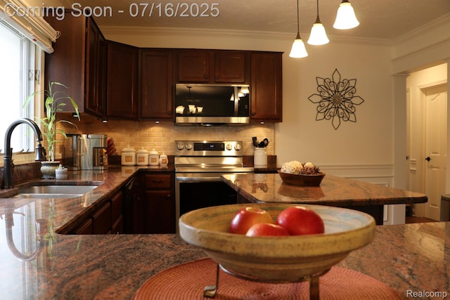 46877 W Ann Arbor Trl, Plymouth, MI 48170 - kitchen featuring stainless steel appliances, decorative backsplash, crown molding, dark stone counters, and hanging light fixtures