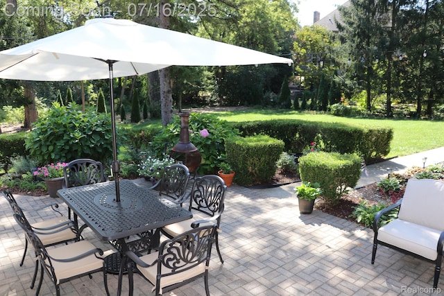 46877 W Ann Arbor Trl, Plymouth, MI 48170 - view of patio / terrace with outdoor dining area