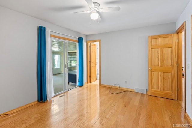 609 N Wickshire Ln, Durand, MI 48429 - empty room featuring ceiling fan and wood finished floors