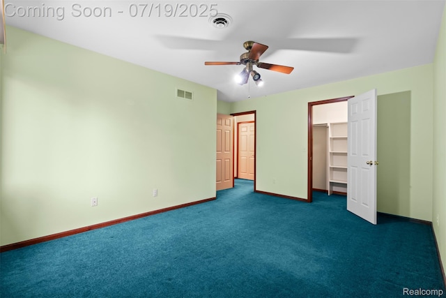 260 Forest Crest Dr, Commerce Twp, MI 48390 - unfurnished bedroom with dark carpet, a spacious closet, and a ceiling fan