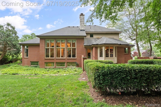 260 Forest Crest Dr, Commerce Twp, MI 48390 - rear view of property with a lawn, a chimney, and brick siding