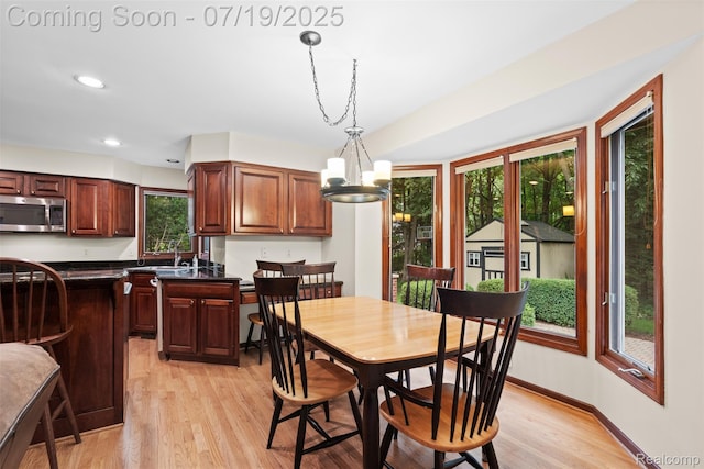 260 Forest Crest Dr, Commerce Twp, MI 48390 - dining room with healthy amount of natural light, a chandelier, light wood-type flooring, and recessed lighting