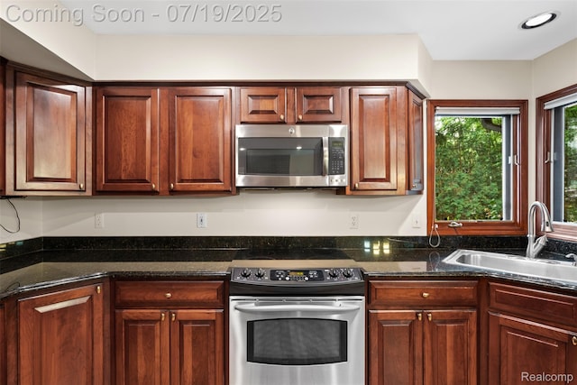 260 Forest Crest Dr, Commerce Twp, MI 48390 - kitchen with appliances with stainless steel finishes and dark stone counters